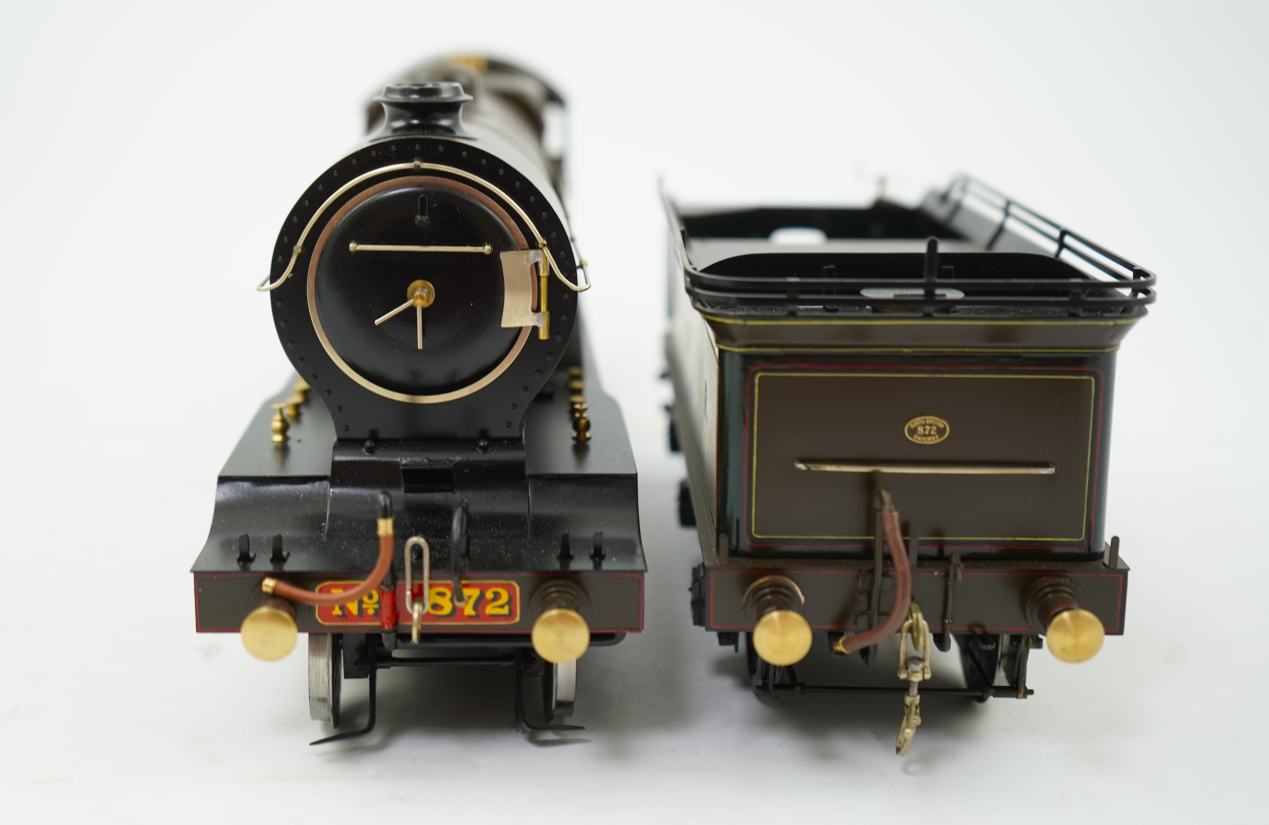 A Gauge One model of North British Railways H Class Auld Reekie 872, 4-4-2 Atlantic tender locomotive, the model has been left unpowered to allow for a high level of detailing of the valve gear and cylinders between the